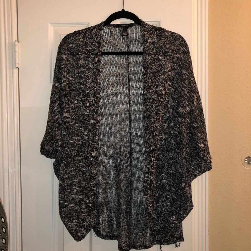 woman’s black and white Forever 21 cardigan